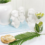 Cute monkey decanters in white ceramic with palm wine and martini glasses.