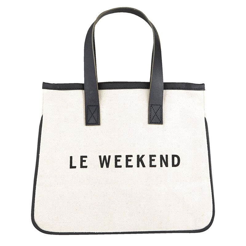 It's "Le Weekend"!  Whether you're traveling to the park or a weekend getaway, this Le Weekend easy tote is perfect for your travel essentials.  You know - Le Weekend flask, Wineaux wine canteen, To Geaux frosted cups - just to name a few of those "essentials"!     Size: 11" W x 9.5" H x 6" Gusset Material: Canvas, Genuine Leather  